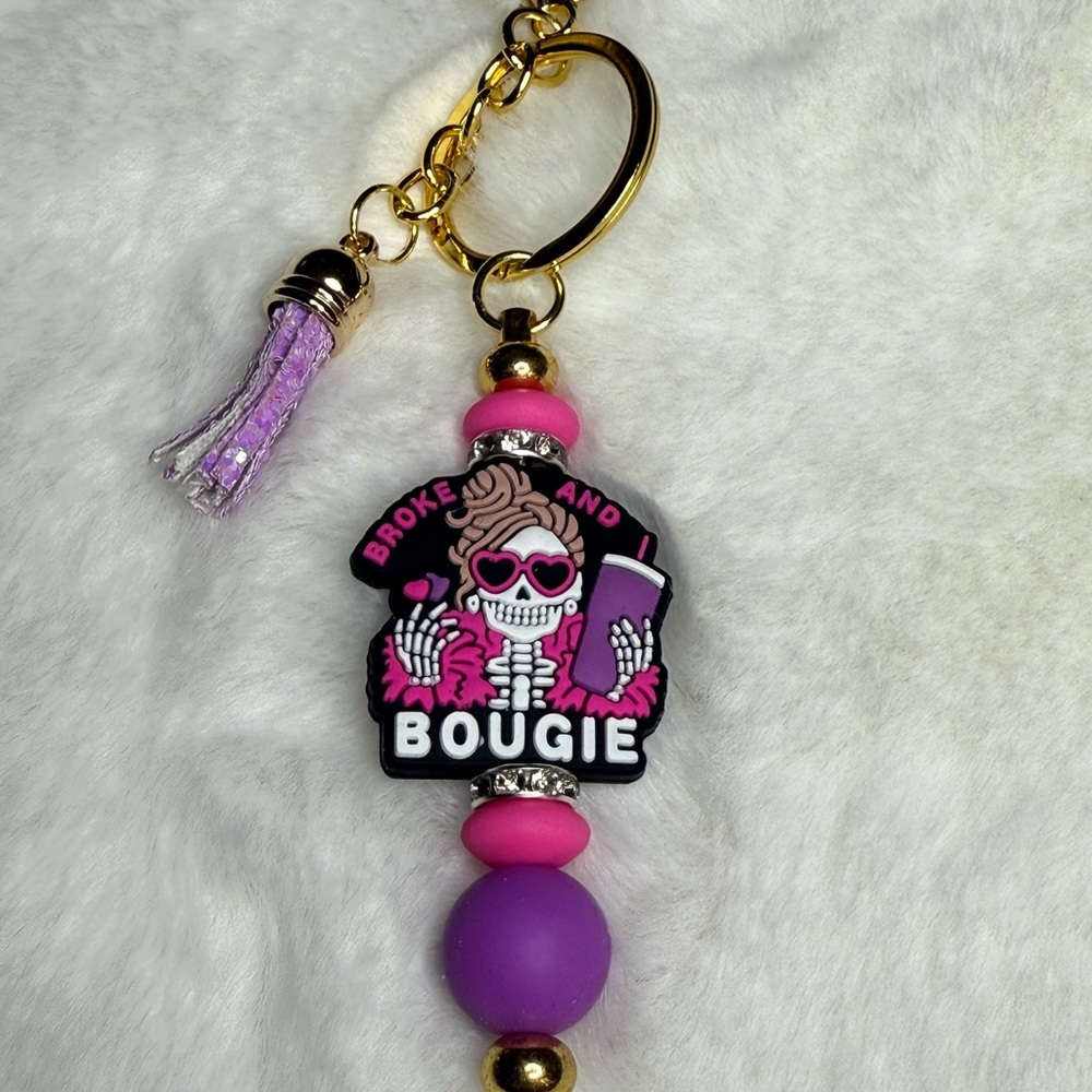 Pink and Gold Keychain with Skeleton Design